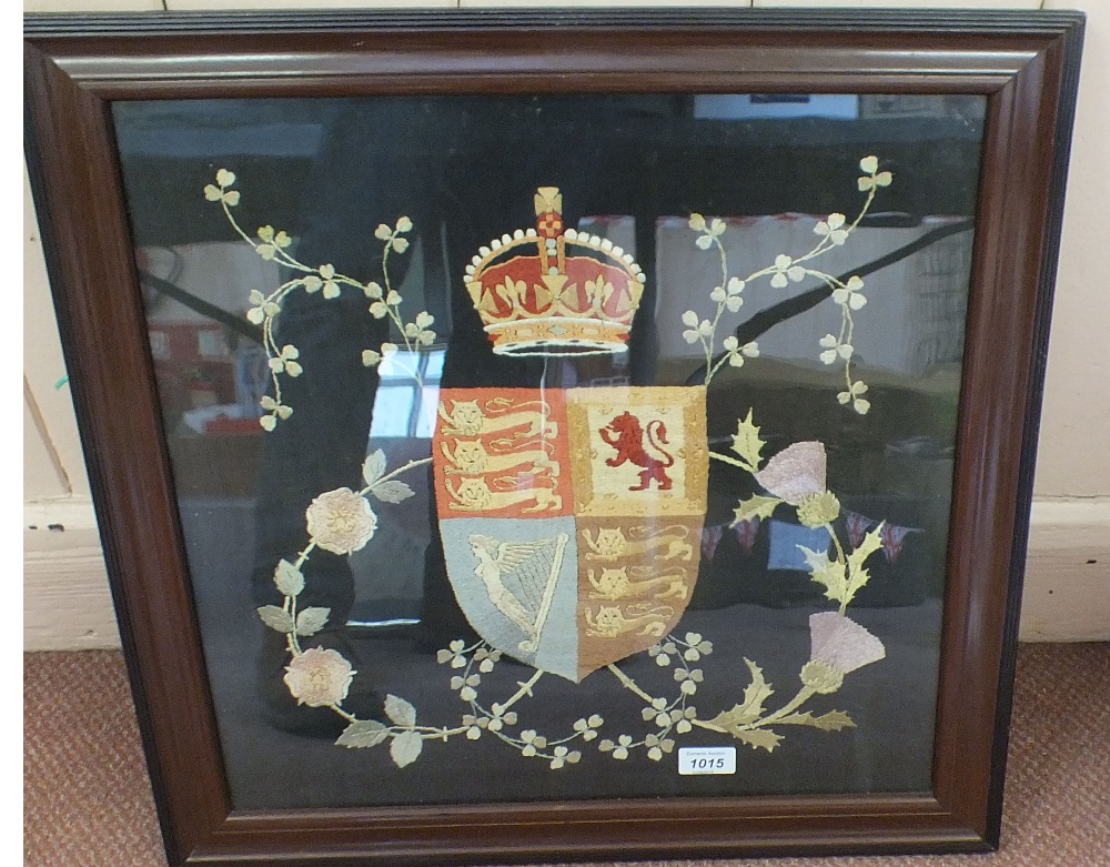 A needlework of the Royal Standard, framed and glazed,