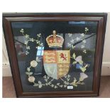 A needlework of the Royal Standard, framed and glazed,