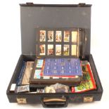 A case containing cigarette and tea cards,