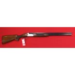 A 12 bore over and under shotgun by Marocchi,