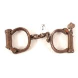 A good pair of 'Hiatt' handcuffs marked Warranted Wrought and numbered 78,