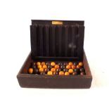 A Remy Martin wooden ball bar game