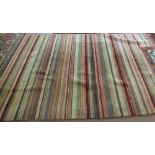 A machine made striped carpet,