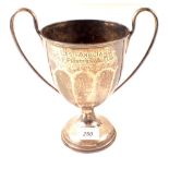 A silver trophy cup with presentation inscription,