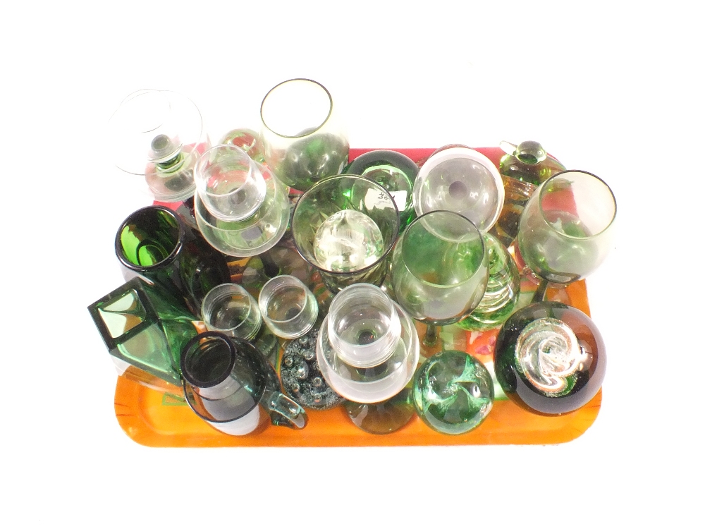 Items of green glass including paperweights,