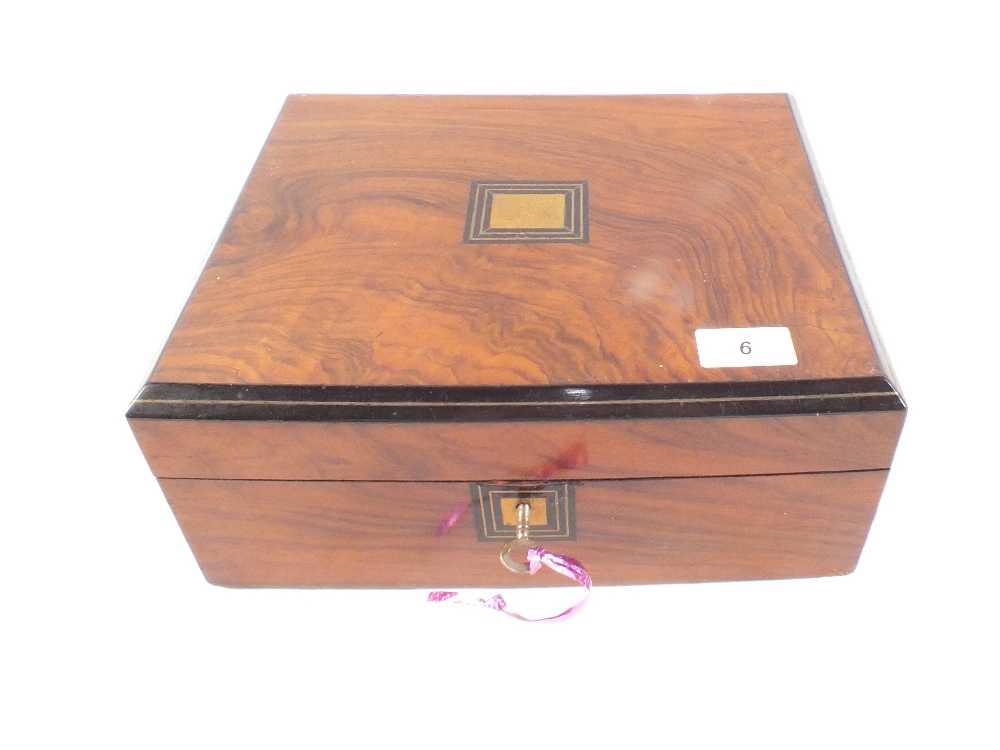 A Victorian walnut and ebonised work box