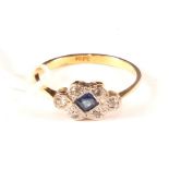 An 18ct gold Art Deco ring set with square cut sapphire and diamond surround,