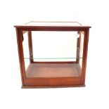 A mahogany glazed rising front table display cabinet