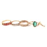 A 9ct gold ring set with white stones, a 9ct gold ring set with green stone,