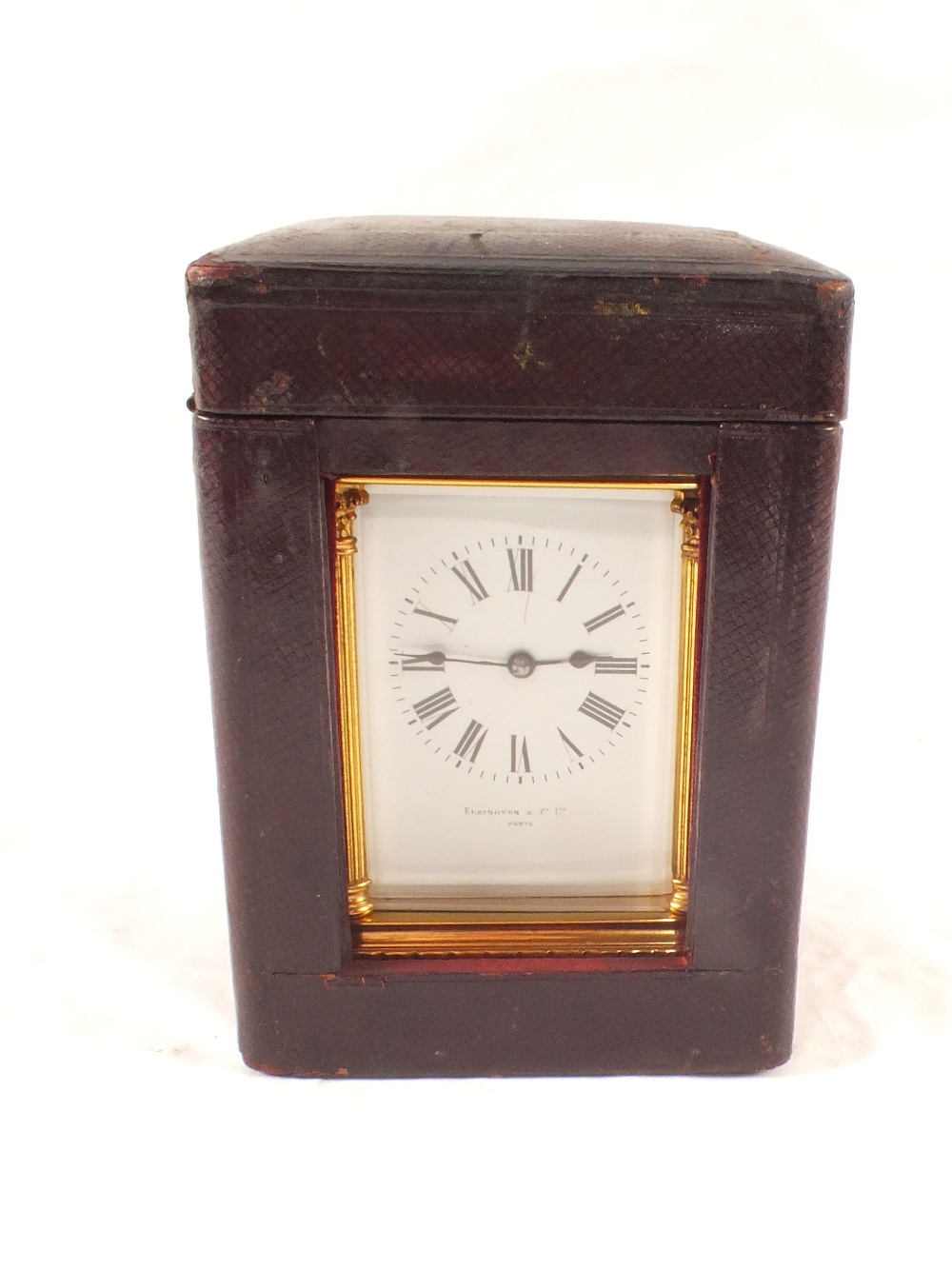 A brass carriage clock in case, dial marked Elkington & Co Ltd,