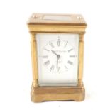 A small brass carriage clock, dial marked Elliott & Son,