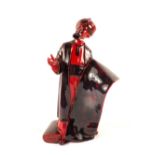 A Royal Doulton Flambe figure 'The Carpet Seller'