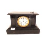A black slate mantel clock with unassociated spelter figure of a seated lady holding compass and