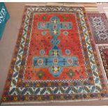 A Turkish geometric red ground carpet,