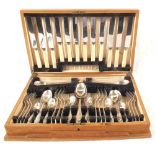 An oak canteen of silver cutlery with stainless knives,