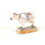 A 19th Century Dutch Delft polychrome cow (one missing horn)