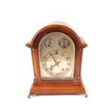 An oak striking mantel clock, silvered dial marked John Dyson & Sons,