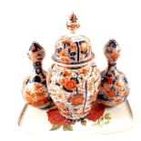 A pair of 19th Century Imari Gourd vases plus a lidded jar