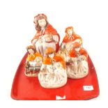 Five Victorian Red Riding Hood figures,