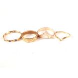 Four rings, 9ct gold band with engraved decoration, 9ct gold tricolour wishbone ring,