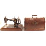 A Singer sewing machine, oak barometer, sundries,