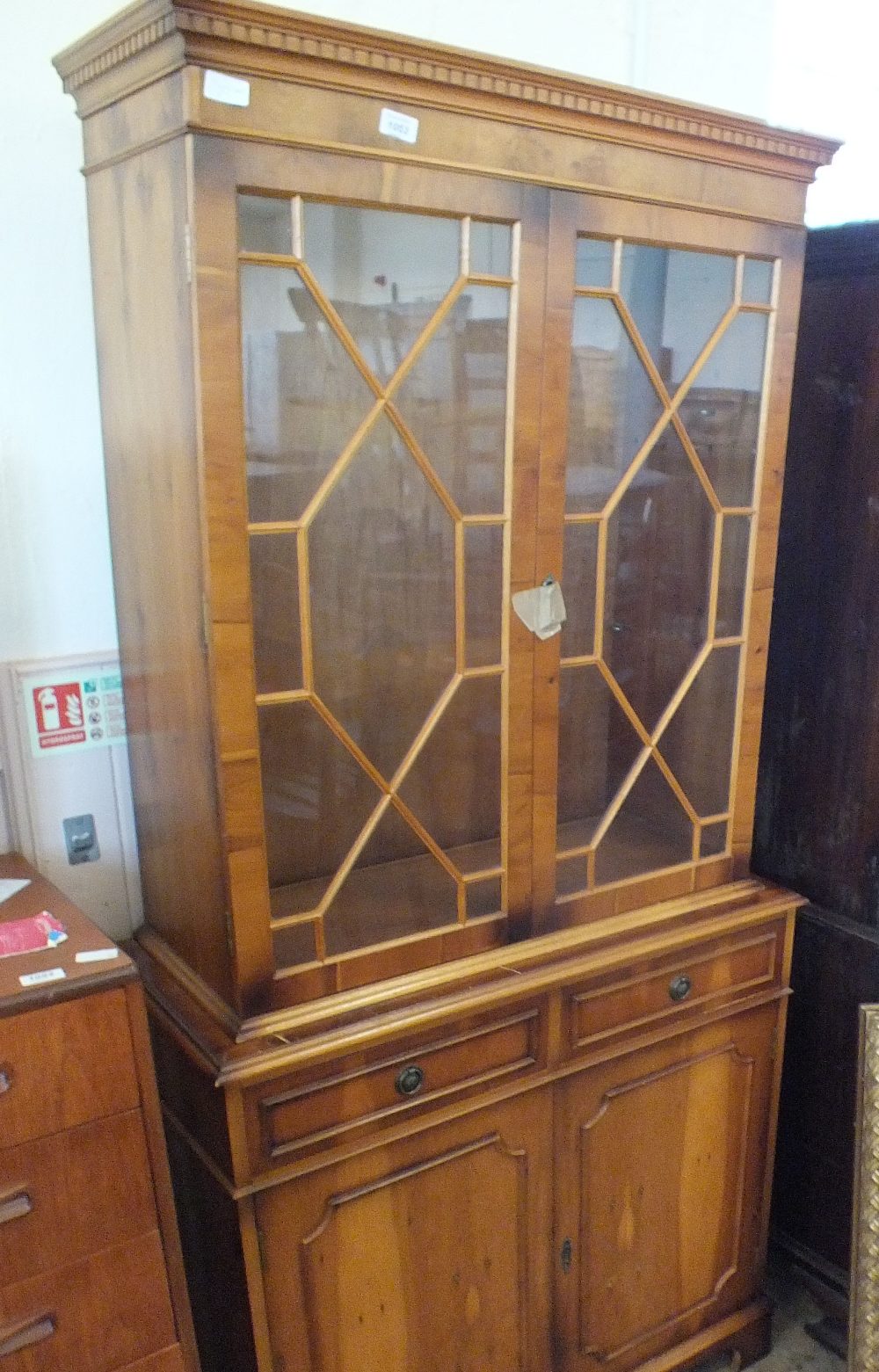 A reproduction yew glazed bureau bookcase