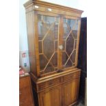 A reproduction yew glazed bureau bookcase