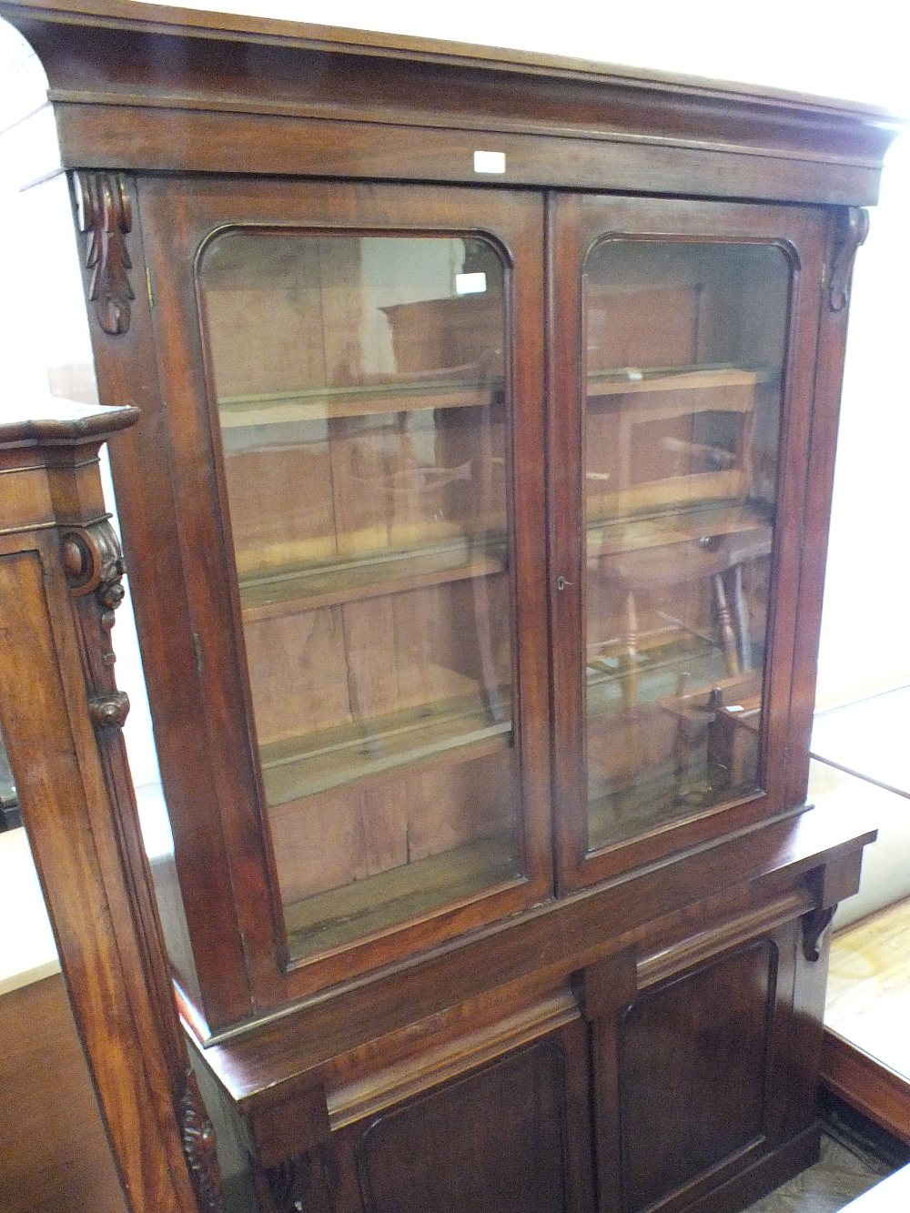 A Victorian mahogany glazed cupboard bookcase