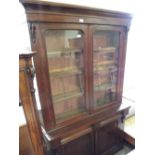 A Victorian mahogany glazed cupboard bookcase