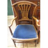 An Edwardian inlaid mahogany elbow chair with blue upholstery