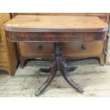 A 19th Century mahogany lift top serving table on quatrefoil base