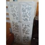 A modern oak white painted and florally decorated wardrobe