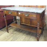 An Edwardian marble top washstand turned legs and two drawers