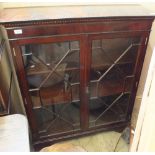 An Edwardian style mahogany glazed bookcase