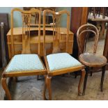 A pair of upholstered high back dining chairs and a cafe chair