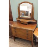 An Edwardian style dressing chest of three drawers with mirror and small drawer above