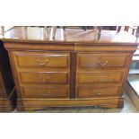 A reproduction chest of six drawers