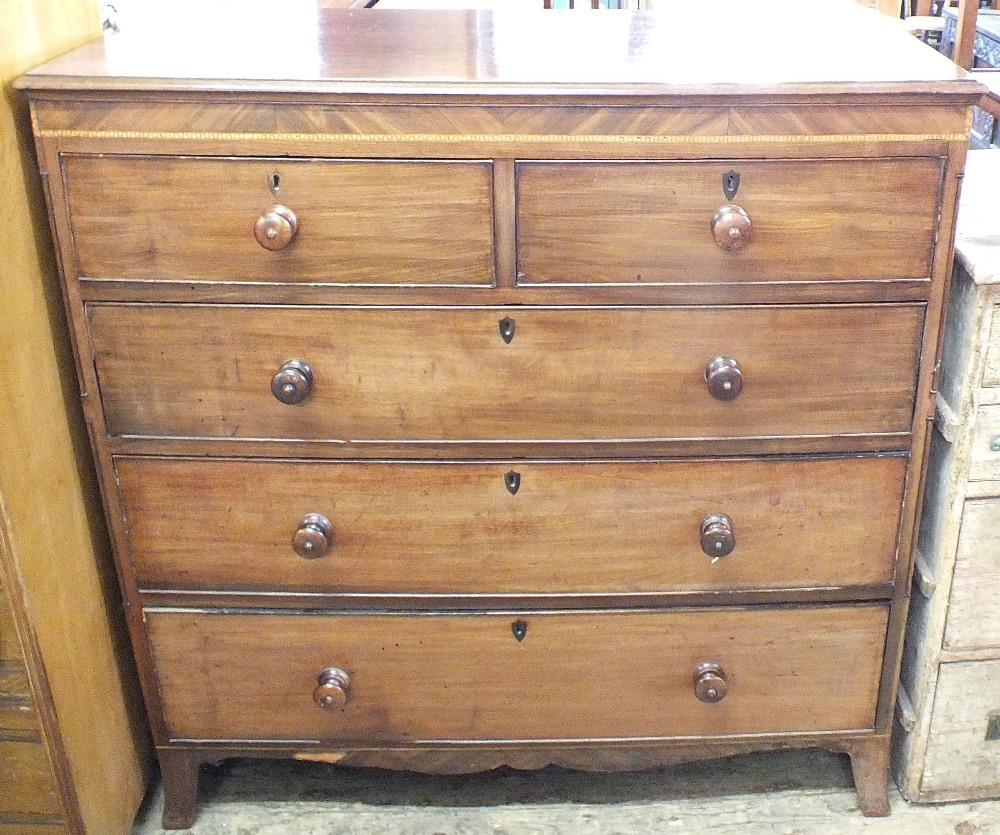 A Regency mahogany chest of five drawers with inlaid crossbanding and column detail