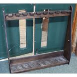 An oak bespoke floor standing gun rack,