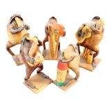 A taxidermy band of five toads playing various instruments