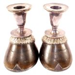 A pair of silver plated mounted candlestick hooves