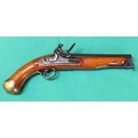 A Flintlock pistol with brass furniture and captive ramrod, lock with border line engraving,