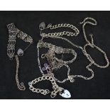 Ten various silver and white metal bracelets and necklaces including an amber droplet necklace