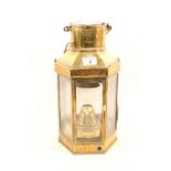 A brass hand lantern by Culpit & Sons,