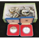 Silver and white metal items including cutlery