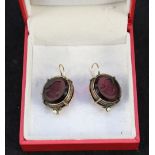 A pair of earrings with mauve stone intaglios