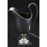 A silver cream jug,