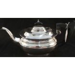 A silver teapot,