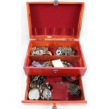 A large black jewellery box with costume jewellery containing beads,