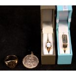 A collection of 9ct gold jewellery including three gents rings,